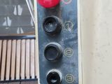 a close up of a red button on a machine