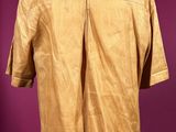 the back of a tan shirt on a mannequin mannequin mannequin mannequin mannequin mannequin mannequin mannequin