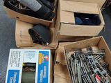 several boxes of assorted items sitting on the floor in a room