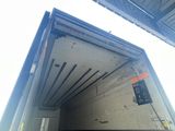 an image of the inside of a truck with the door open