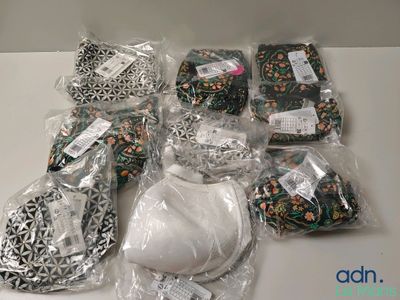 many items that are wrapped in plastic bags on the table