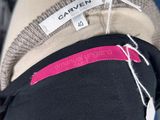 the back of a mannequin with a label on it
