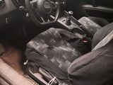 dashboard of a car with a bag in the passenger seat