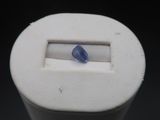 a blue stone in the middle of a white object