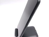 a close up of a cell phone on a stand