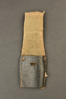 a close up of a small knife on a piece of cloth