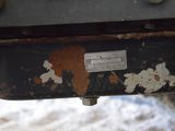 a close up of a rusted metal object on the ground