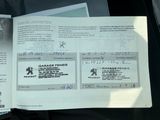 a passport sitting on top of a car seat in the back of a car