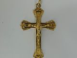 gold plated cross on a white background