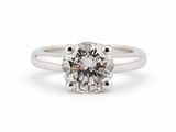 a close up of a diamond ring on a white background