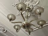 a chandelier hanging from the ceiling in a room