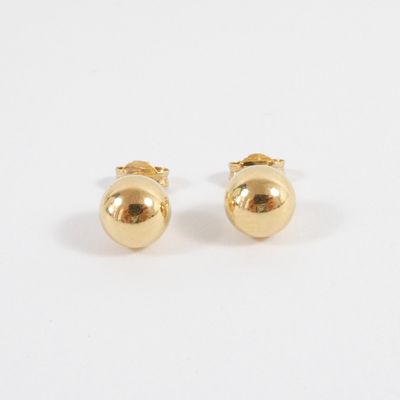 a pair of gold earrings on a white background