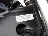 a close up of a motorcycle engine with a sticker on it