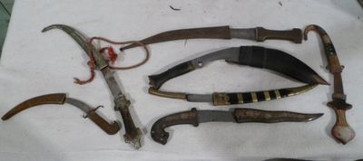 many different types of knives on a table