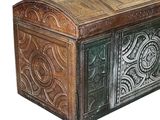 a wooden chest with a decorative design on it