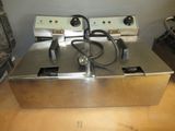 an image of an electric fryer sitting on a table