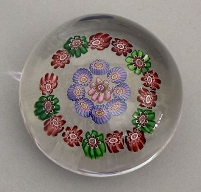 a glass plate with a colorful flower design on it