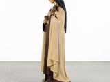 a statue of a woman with a nun holding a rosary