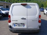 a white van that is parked in a parking lot