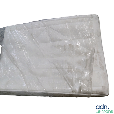 a mattress that is wrapped in plastic on a white background