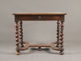 an old wooden table with a drawer on top of it