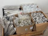 several boxes filled with different types of plastic items sitting on a pallet