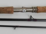 a close up of a fishing rod and a fishing rod on a table