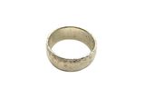 a close up of a gold ring on a white background