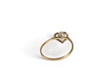 a close up of a gold ring with a diamond on it