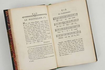 an open book with a page in it on a table