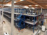an aerial view of a large warehouse with a lot of shelves