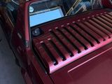 an image of a red car parked in a garage