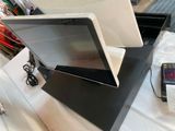 a computer monitor sitting on top of a table
