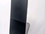 a cell phone that is sitting on top of a stand