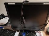 a laptop computer sitting on top of a desk with a keyboard and mouse