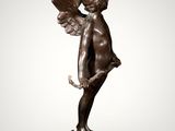 an image of a bronze statue of a boy with wings