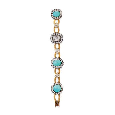 a close up of a bracelet with turquoise stones on it
