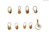 an image of a set of five pairs of earrings and a pendant