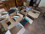 a room full of boxes and other things on the floor