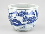 a blue and white bowl with a mountain scene on it