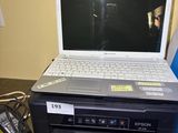 a laptop computer sitting on top of a dvd player
