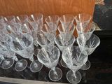 a lot of wine glasses sitting on a table