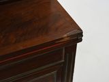 a close up of a wooden cabinet with a clock on top