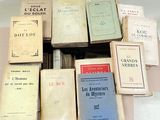 a lot of books that are sitting on a table