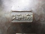 a close up of a metal object with a label on it