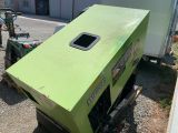 a large green box sitting on top of a small truck