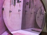 a mirror that is sitting on the wall in the bathroom