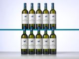 six bottles of white wine sit on a shelf in front of a glass shelf