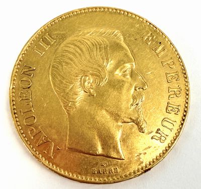 une image montrant un gros plan d'une pièce d'or sur laquelle figure le visage d'un homme