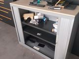 a small cabinet with a computer on top of it